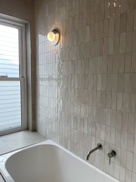 Accent lighting used on bathroom feature wall